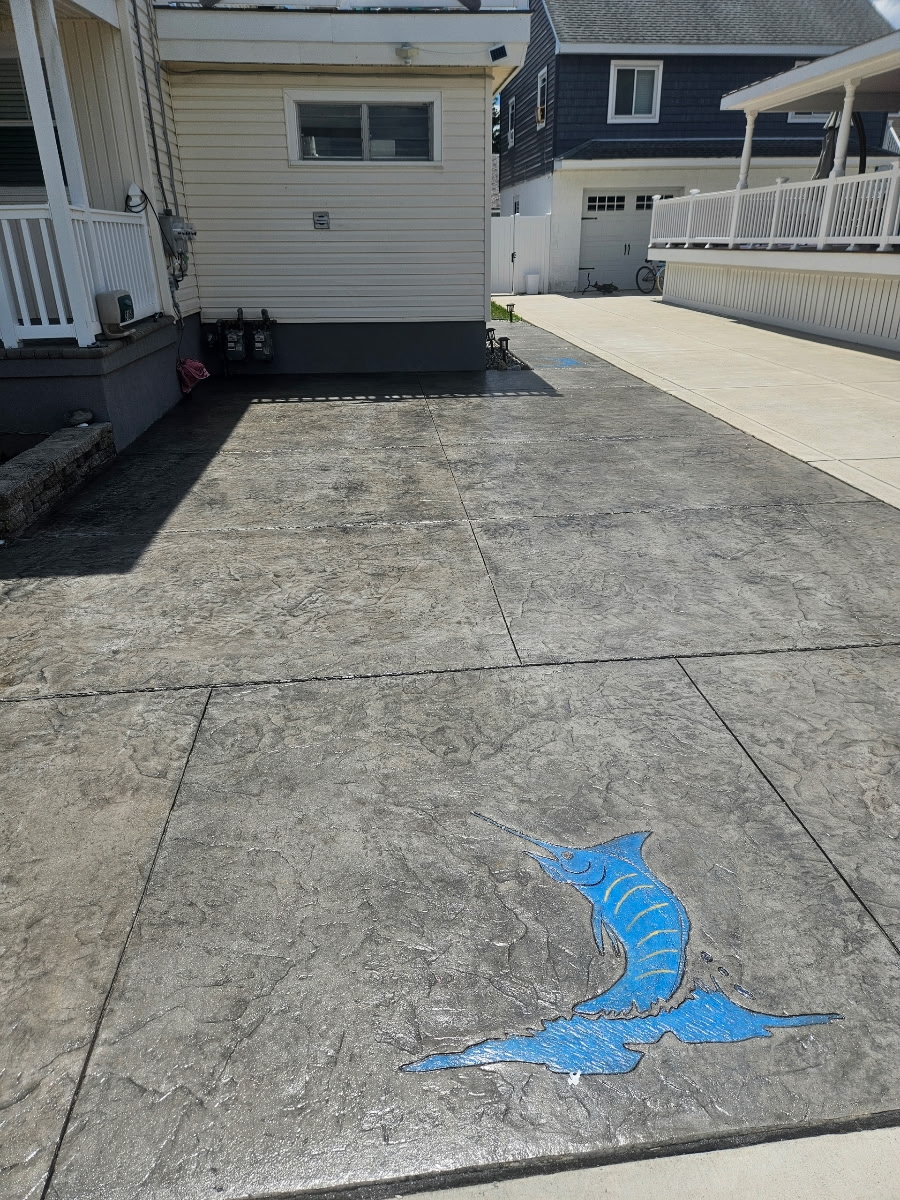 Custom Stamped Concrete Patio with Marlin Inlay